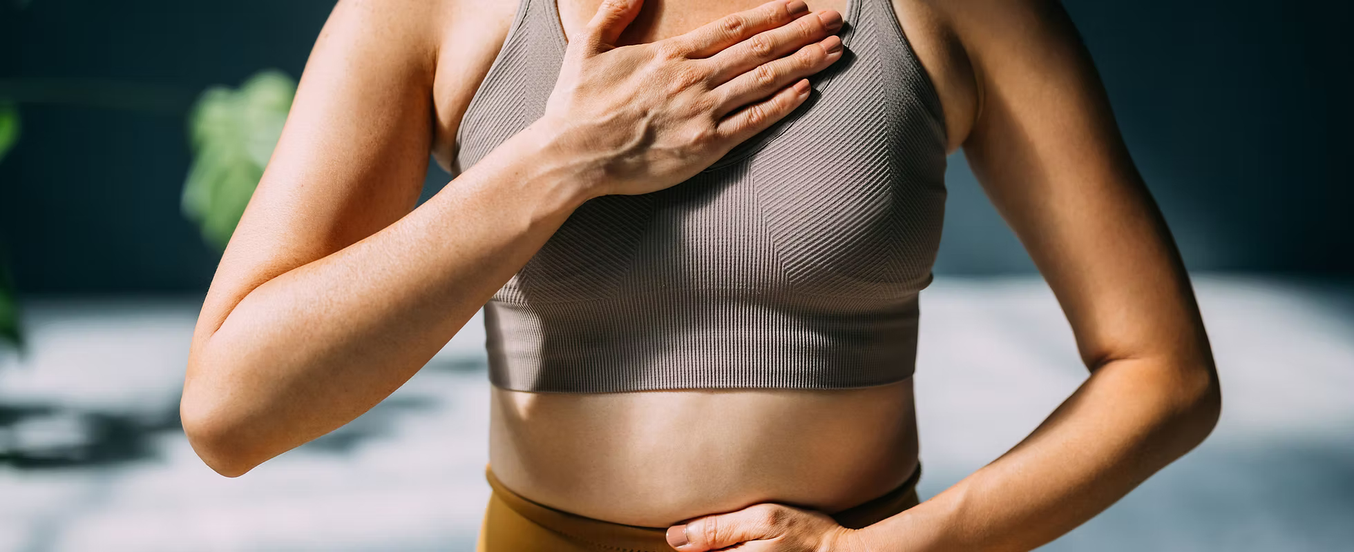Person practicing breathing exercises for body-based therapy and nervous system regulation