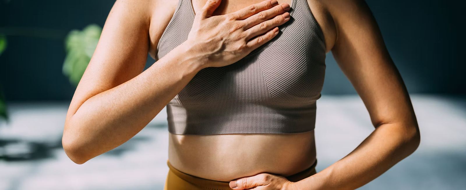 Person practicing breathing exercises for body-based therapy and nervous system regulation