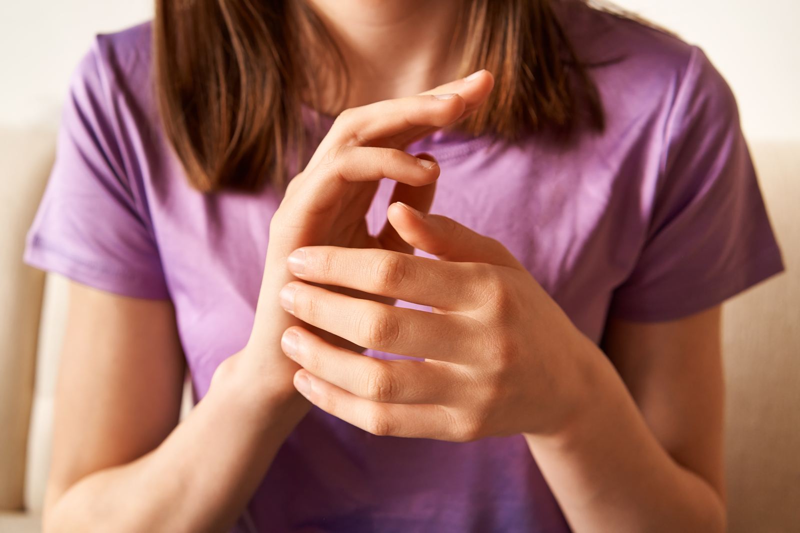 Person demonstrating EFT tapping technique on acupressure points